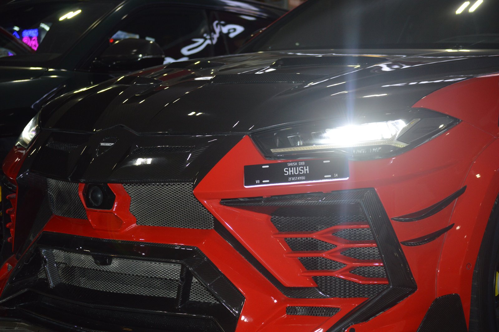 SHUSH plate on red SUV