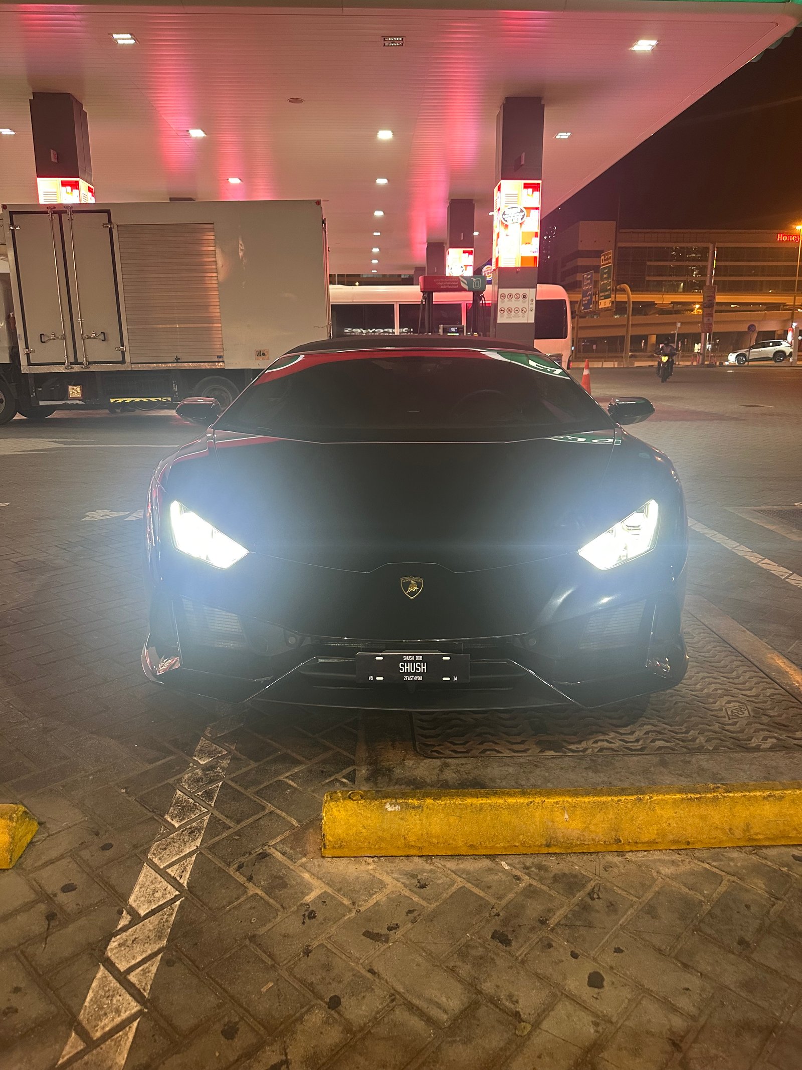 Lamborghini with SHUSH plate at gas station
